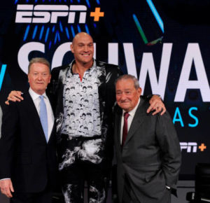 Fury posing with Frank Warren and, promoter, Bob Arum
