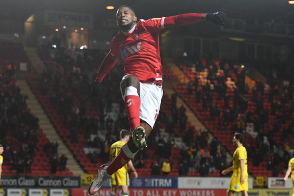 Chuks Aneke jumps for joy after scoring against AFC Wimbledon at The Valley