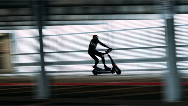 An image of a rider on a prototype racing electric scooter