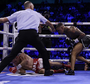 Boxer Conor Benn stands over his fallen opponent after knocking him down