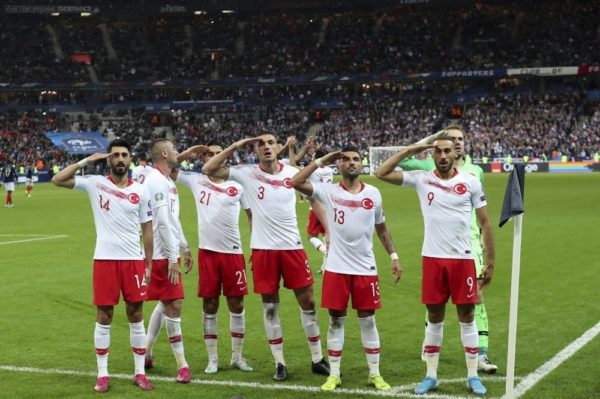 Turkey's football players celebrate scoring with a military salute