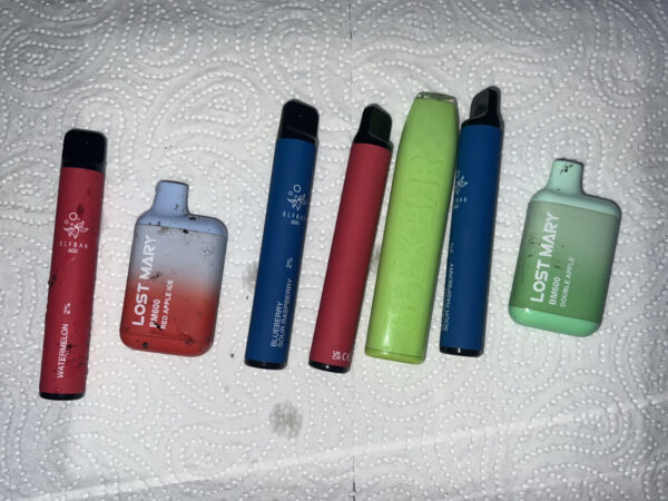 A selection of 7 littered disposable vapes found on a one hour walk around Leytonstone, East London.
